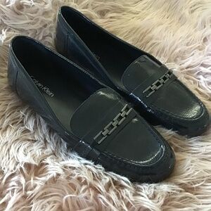 Calvin Klein Glossy Black Loafers with Chain Accent